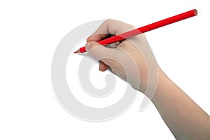 Child hand draws a red pencil