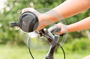 Child hand on the handlebar close up image