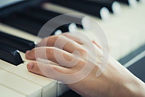 Child Hand playing Music keyboard piano