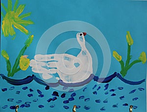 Child hand print finger paint drawing of a bird on water