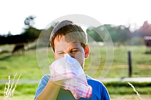 Child with handkerchief in nature photo