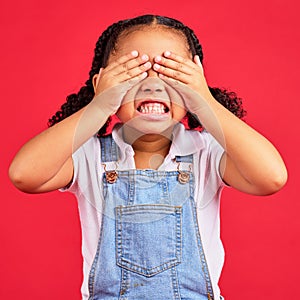 Child, hands and eyes cover on isolated red background with angry, mad or stubborn facial expression. Girl, kid and