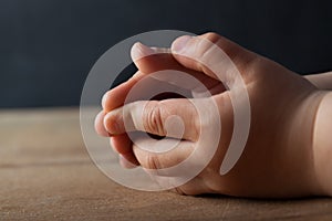 Child hands folded for prayer