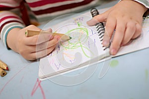 Child hands playing with colorful plasticine during quarantine Covid-19