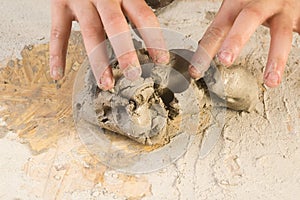 Child hands of a potter