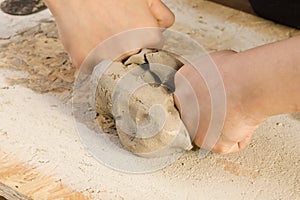 Child hands of a potter