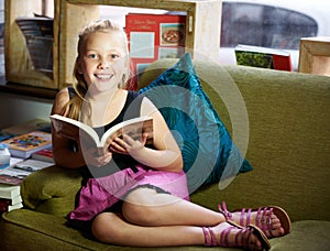 Child, happy portrait and reading book for learning, education and story, knowledge or creative mindset. Kid or girl