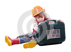 Child in hardhat with working tools