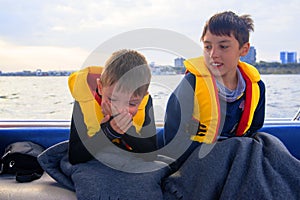 The child has seasickness on the boat.