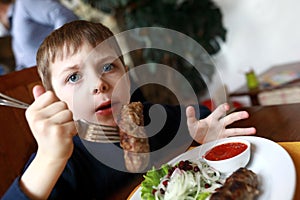 Child has veal lula kebab