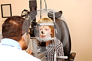 Child having eye examination with Slit Lamp