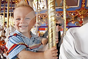 Child Having Fun on the Merry-Go-Round