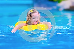 Child having fun in a swimming pool