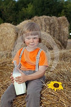 Child on a haystack with