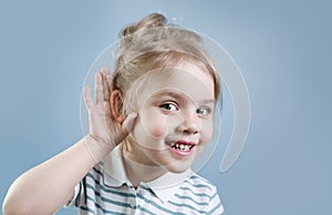 Child hear. Hearing loss, symptoms and treatment concept. Kid portrait.Gossip and news