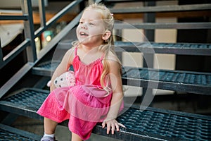 Child with hearing problem and cochlear implant have fun in street, deaf kid began to hear. Hearing loss in childhood