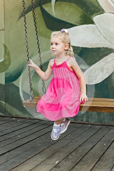 Child with hearing problem and cochlear implant have fun in street, deaf kid began to hear. Hearing loss in childhood