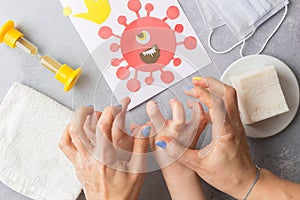 Child and her mother hands in soap frighten drawn corona virus covid-19 Hand washing with soap to