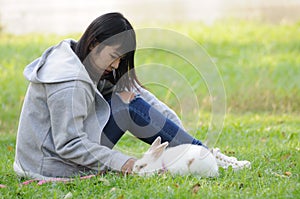 Child and Her Pet Bunny Playing Outdoors