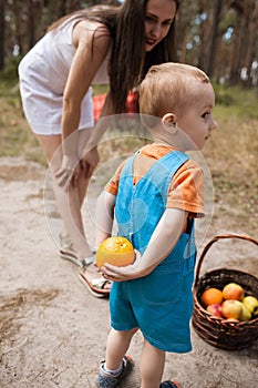 Child hide orange family picnic concept.