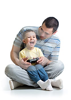 Child and his father play with a playstation together