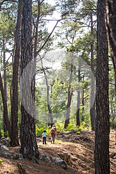 A child with his mother go hiking