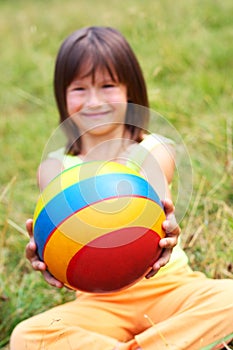 The child hold a ball