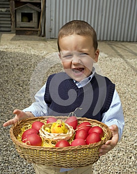 Child holding a basket eggs