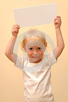 Child holding blank placard