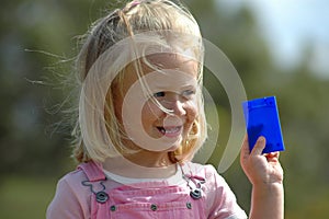 Child holding card
