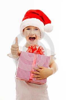 Child holding Christmas gift box in hand. on background
