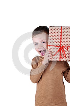 Child holding Christmas gift box in hand. Isolated on white background