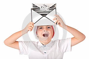 Child holding Christmas gift box on his head say something . Isolated on white background