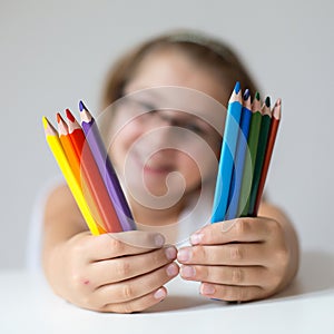 Child holding crayons