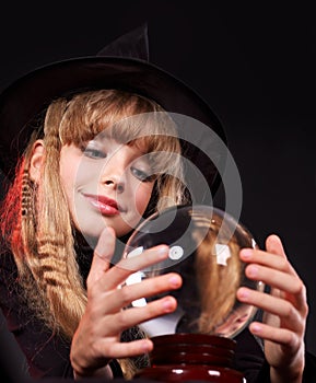 Child holding crystal ball.