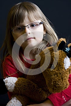 Child holding cuddly toy photo