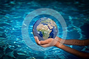 Child holding Earth planet in hands