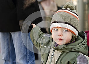 Child holding father's hand