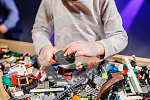 Child holding lego blocks 2018