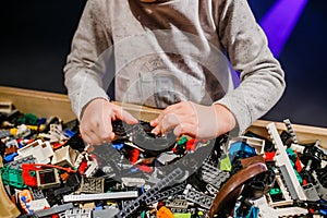 Child holding lego blocks 2018