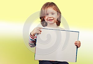 Child holding a open book