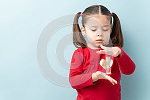 Child holding a sand timer during timeout photo