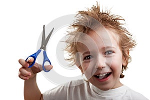 Child holding scissors photo