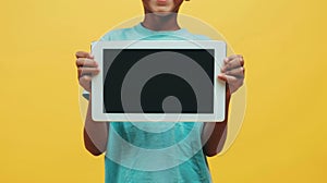The child holding tablet.AI generated image