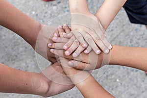 Child holding their hands together in shape.