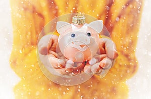 Child holds a Christmas decor and gifts on a white background. Selective focus