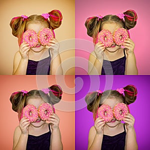 A child holds donuts near his eyes and looks through the holes like through glasses