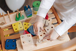 Child holds educational toys