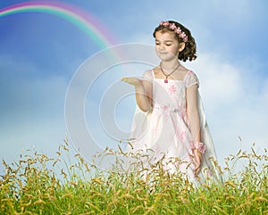 Child holds the end of the rainbow in her hand