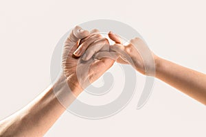 Child hook little finger together. Little finger of the two hands hold together. Show friendship and forgiveness